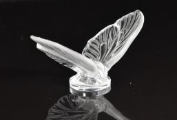 Lalique Papillon Aurore open wing butterfly, raised on a circular base with engraved 'Lalique', H5.
