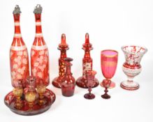 Collection of 19thC ruby / cranberry glassware including liqueur set, wine bottles, goblet etc.,