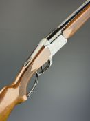 Unnamed 20 bore over and under folding poacher's shotgun with engraved scenes of dogs to the action,
