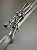 Remington 700 .223 bolt-action rifle with composite stock, semi-pistol grip, sling mounts, Edgar