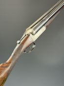Thomas Wild 12 bore side by side shotgun with engraved scenes of dogs and birds to the named