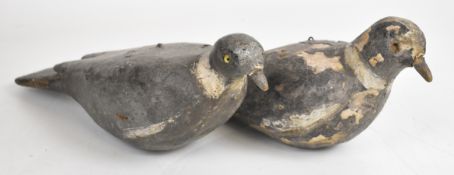 Two Victorian carved and painted pine shooting decoy pigeons each with glass eyes and hanging