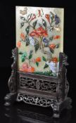 Chinese jade or similar plaque on stand with carved hardstone flora and fauna decoration, W15 x