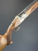 Beretta DT11 Trap 12 bore over and under ejector shotgun with named action and underside,