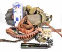 A collection of gun and shooting accessories including five shotgun cartridge bags, four shotgun