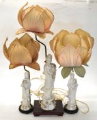 Three Chinese blanc de chine figural Guanyin lamps with lotus leaf shades, tallest 96cm with shade