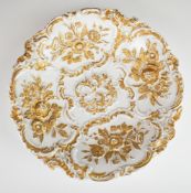 Meissen pedestal bowl with gilded relief moulded decoration and blue crossed swords mark to base,
