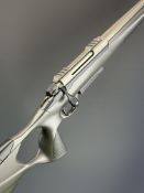 Sako S20 .243 bolt-action rifle with composite stock, textured thumb-hole grip and forend,
