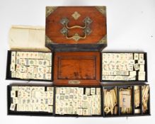Early 20thC brass bound bone and bamboo Mah Jong set with slide out front, five drawers, twin