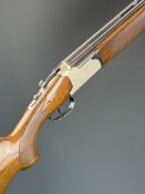 Lanber 12 bore over and under ejector shotgun with engraved scenes of birds to the action and