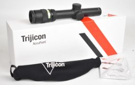 Trijicon AccuPoint TR24-C-200071 green dot rifle scope, in original box with instructions.