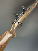 Steyr Mannlicher Jagdmatch SL .222 bolt-action rifle with laminate show wood stock, chequered semi-