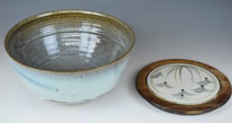 Large Winchcombe pottery bowl and an inset Winchcombe bread board, the dish diameter 30 x height
