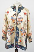 Early 20thC Chinese cream silk tunic / coat embroidered with pagoda and floral decoration, the tunic