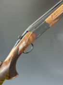 ATA 12 bore over and under ejector shotgun with chequered semi-pistol grip and forend, vented top