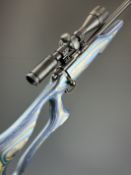CZ 455 .17 HMR bolt action rifle with blue laminate show wood skeleton stock, raised cheek piece,