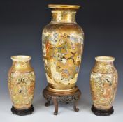 19th/20thC Japanese garniture of three Satsuma vases with figural Samurai decoration, raised on