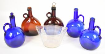 Five 19thC and later brown and blue glass flask decanters and a twin handled iridescent / opalescent
