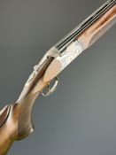 Beretta 682 Gold E 12 bore over and under ejector shotgun with gold inlaid naming, chequered semi-