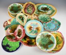Seventeen 19th/20thC English and continental Majolica plates / dishes with flora and fauna