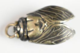 Japanese gaming pendant in the form of a cicada with hinged wings and inner compartment with three