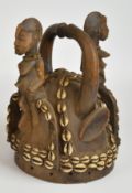 African tribal figural fertility headdress, probably Yoruba tribe Nigeria, decorated with cowrie