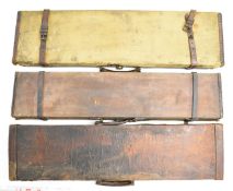 Three shotgun carry cases, all with fitted interiors comprising two canvas and leather bound