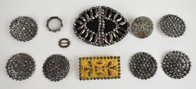 A collection of Victorian cut steel including six buttons, pinchbeck brooch, ring and buckle