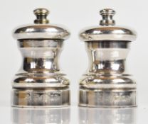 Pair of modern feature hallmarked silver salt and pepper grinders, London 2001, maker M C Hersey &
