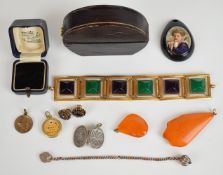 A collection of jewellery including rolled gold bracelet, two amber pendants, antique bangle box,