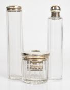 Four various hallmarked silver mounted glass dressing table bottles, length of longest 16.5cm,