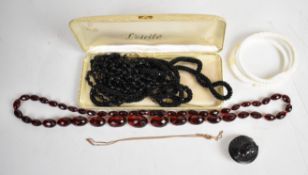 A collection of jewellery including jet cameo brooch in the form of a Roman solider, two French