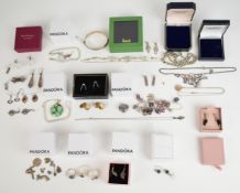 A collection of silver jewellery including bangle, rope twist necklace, eight pairs of earrings, two