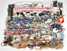A collection of jewellery including two Monet bracelets, Monet necklace, two tiger's eye pendants