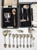 Cased hallmarked silver egg cup and spoon, cased hallmarked silver spoon and pusher set,