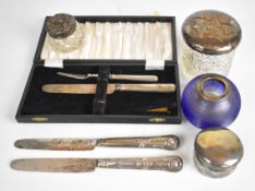 Hallmarked silver mounted items comprising blue glass match striker, three silver lidded pots,