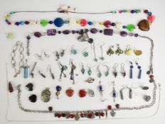 A collection of jewellery including seven pairs of silver earrings, five silver pendants, silver