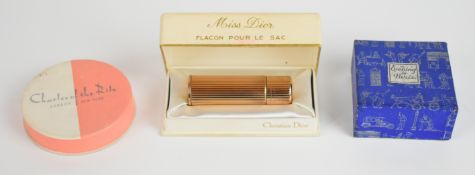 Christian Dior perfume bottle in original box, Charles of the Ritz powder and Evening in Paris