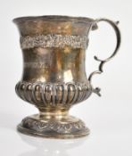 Georgian hallmarked silver mug with ornate grape and vine decoration, lobed lower body and leaf