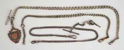 Three silver curb link Albert / watch chains, one with a fob and another a charm in the form of a