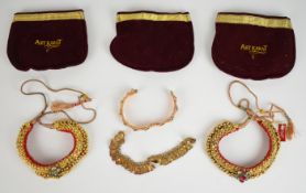 Two gold plated collars, a coin bracelet and a bangle