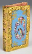 19thC enamel and ormolu / brass needle case in the form of a book with six leaves, with Bilston