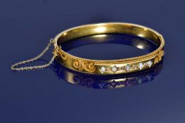 Edwardian 15ct gold bangle set with five opal cabochons and old cut diamonds and with applied