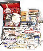 A collection of jewellery and watches including Avon, Hollywood brooch, badges, vintage brooches,
