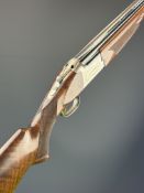 Browning 325 12 bore over and under ejector shotgun with named and engraved action and underside,