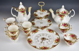 Royal Albert tea and decorative ware including coffee and tea pots, clock, two tier cake stand