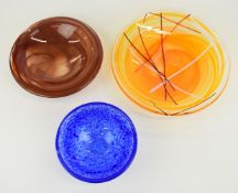 Three Kosta Boda glass dishes / bowls, some possibly by Anna Ehrner, all signed or with original