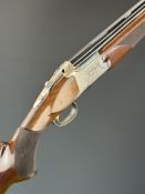 Browning B525L 12 bore over and under ejector shotgun with engraved scenes of birds to the action,