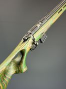CZ 452-2E ZKM American .17 HMR bolt action rifle with green laminate show wood stock, thumb-hole
