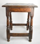 17th/18thC peg jointed oak joint stool with turned stepped canted legs united by four straight